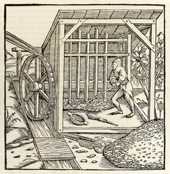 Těžba vodním kolem, z roku 1550 vydání ‚Cosmographia‘ od Sebastiana Munstera (dřevořez)