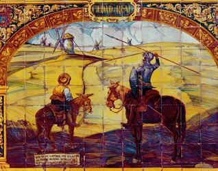 Dlaždice zobrazující Dona Quijota a Sancha Panzu, jak se připravují na útok na větrné mlýny (keramické)