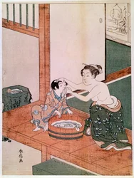 Nahá matka myje v Japonsku své dítě vedle nádoby naplněné vodou. Tisk od Suzukiho Harunobua (1725-1770). 1766-1768. Rozměry: 0,27 x 0,201 m. Paříž, Musée Guimet, Národní muzeum asijského umění