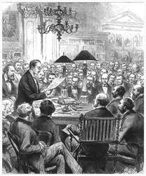 Heinrich Schliemann přednášel v Londýně, 1877