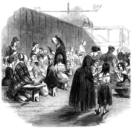 Výuka dívek číst ve škole Ragged School Union, Lambeth, Londýn, 1868