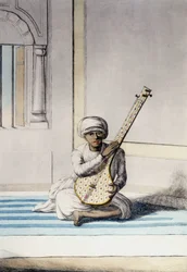 Kultura, civilizace a indická společnost: Hudebník hrající na Thambourah (Tamboura), tradiční nástroj Indie. Rytina 1808.