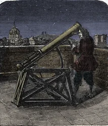 Isaac Newton (1642-1727) anglický fyzik pomocí svého dalekohledu.