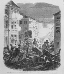 Revoluce v březnu 1848: barikáda v Berlíně dne 19.03.1848. Fridrich Vilém IV. Pruský bude veden k přijetí znovusjednocení a liberální vlády.