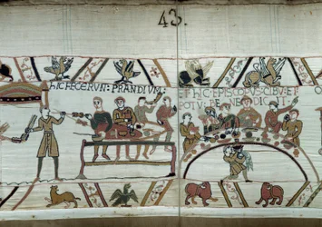 Debarques v Anglii, paže Viléma Dobyvatele (1027-1087) pořádají hostinu při čekání na boj se saskými zbraněmi Harolda II. Guillaume je obklopen barony a Eveque Odon Detail tapisérie z Bayeux nebo výšivky královny Mathildy