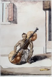 Indická kultura, civilizace a společnost: hudebník s tradičním indickým strunným nástrojem. Rytina z roku 1808.