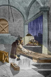 Kněz Pierre Aupetit obviněný z čarodějnictví mučen před upálením zaživa, 25.5.1588 (rytina)